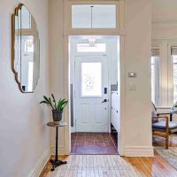 Entryway with tile flooring and high ceilings